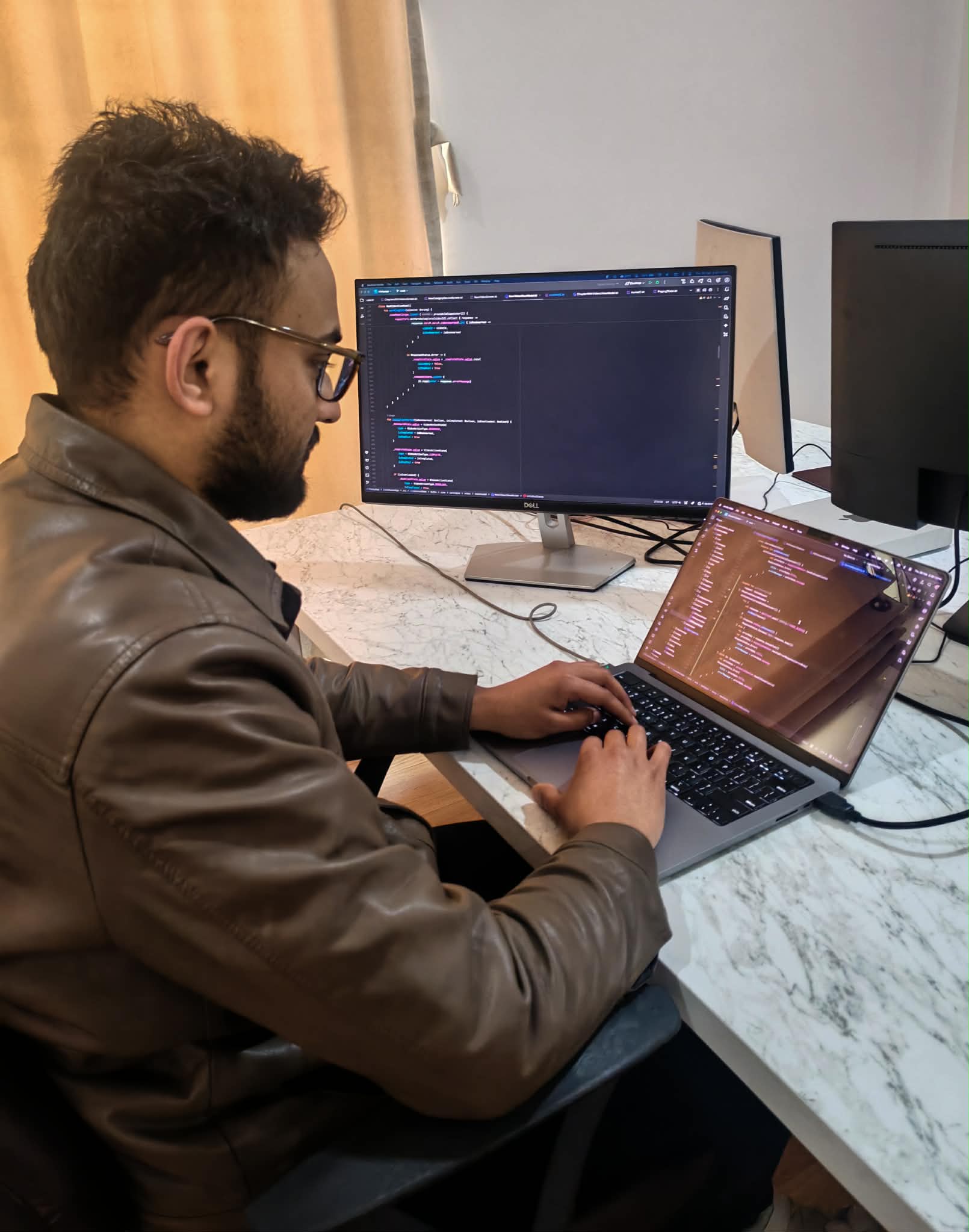 Illustration of a person using a laptop, connected to icons representing data analytics, cloud services, communication, and successful project completion, symbolizing comprehensive digital solutions from Saral Apps.